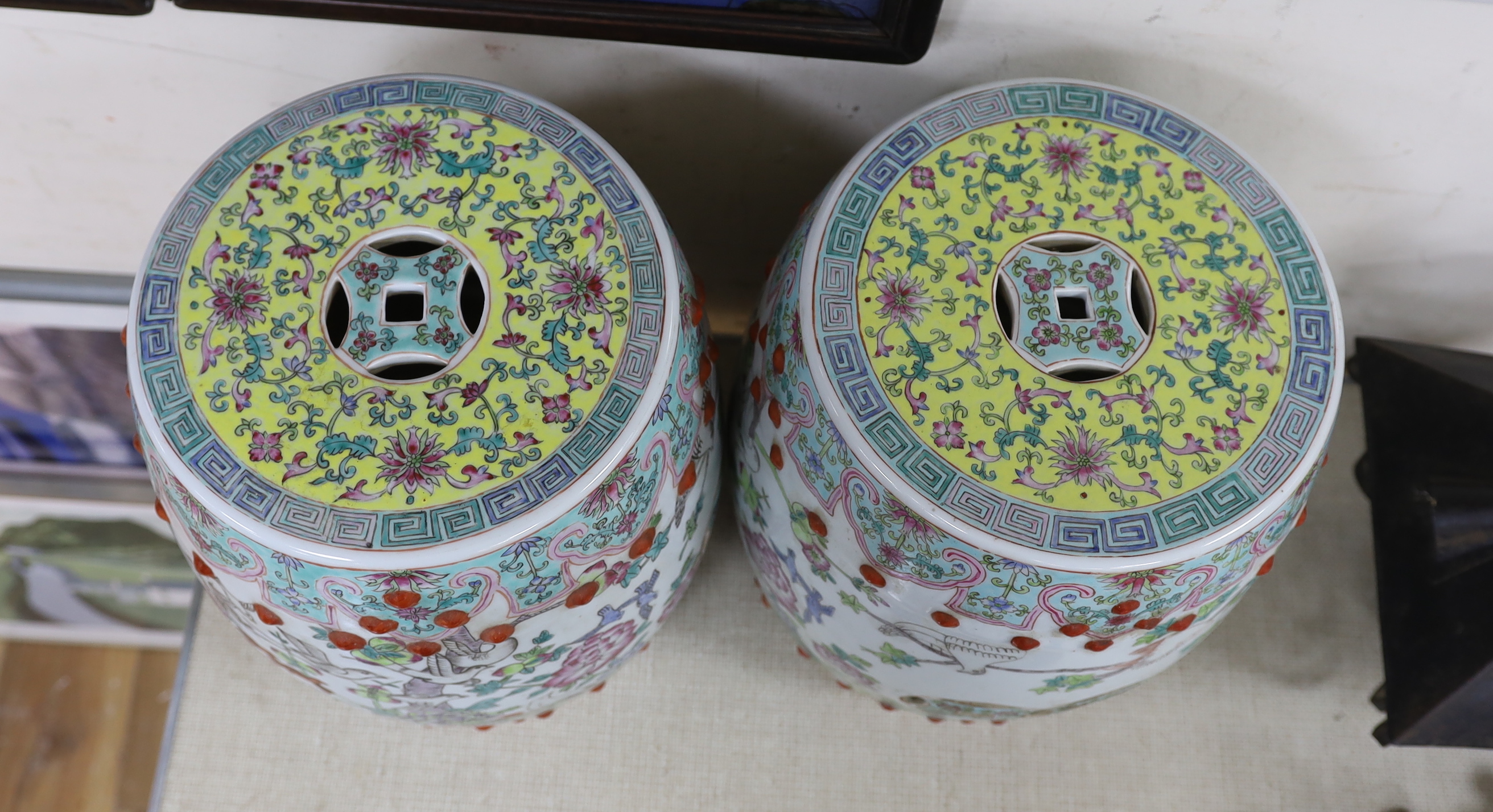 A pair of Chinese famille rose ‘Hundred bird’ garden seats, 37cm high